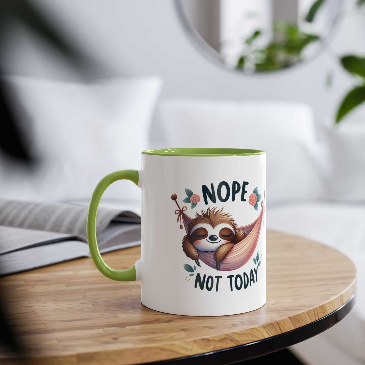 Cute sloth coffee mug with "Nope Not Today" design on a wooden table.
