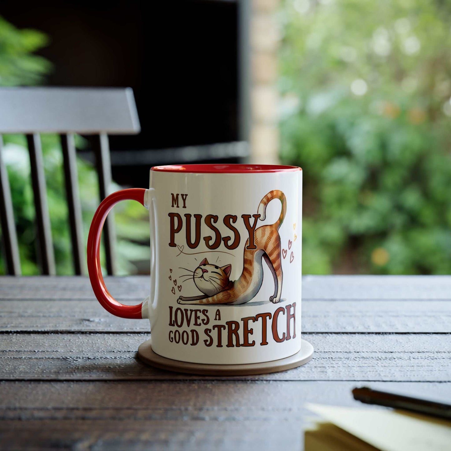 Cheeky Fun Coffee Mug with playful cat design on table.