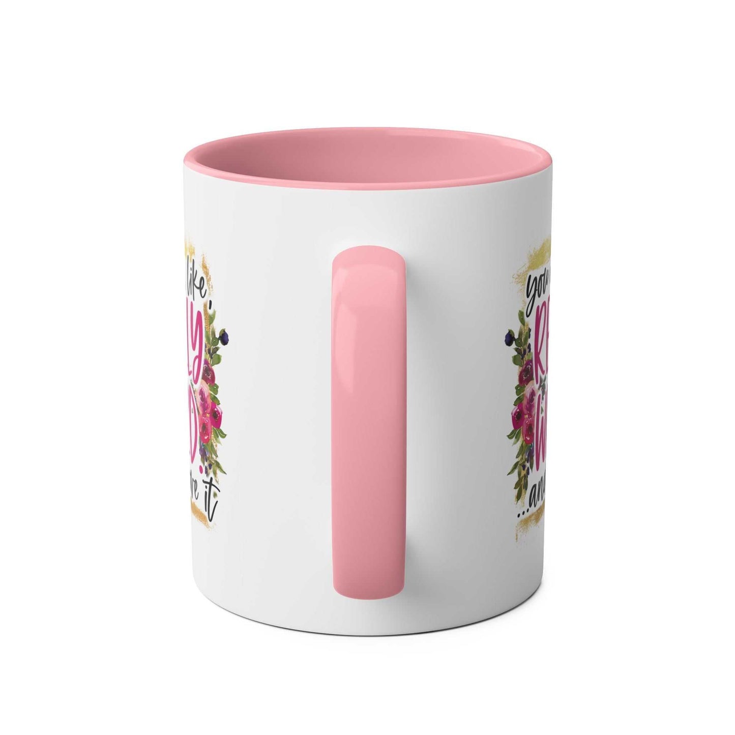 Pink and white ceramic mug with floral design, featuring the "Really Weird Coffee Mug" theme.