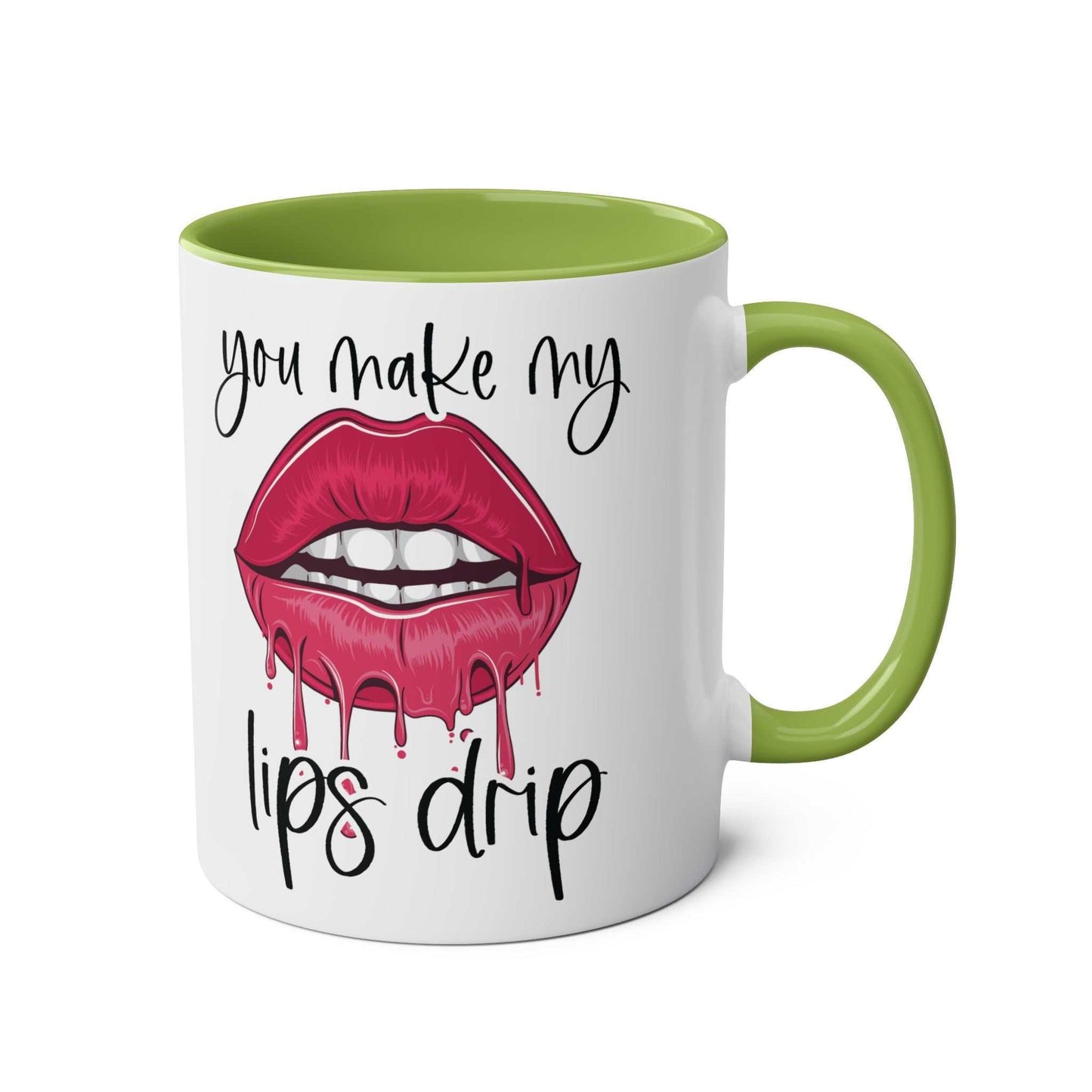 Ceramic mug with "You Make My Lips Drip" design, green handle and rim.