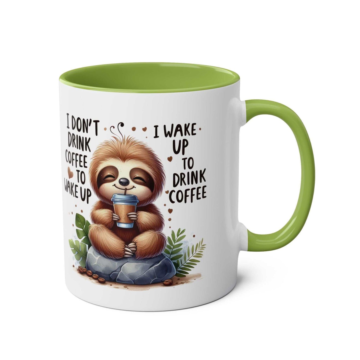 Cute sloth coffee mug with green handle, featuring a cheerful sloth holding a coffee cup amidst whimsical text.