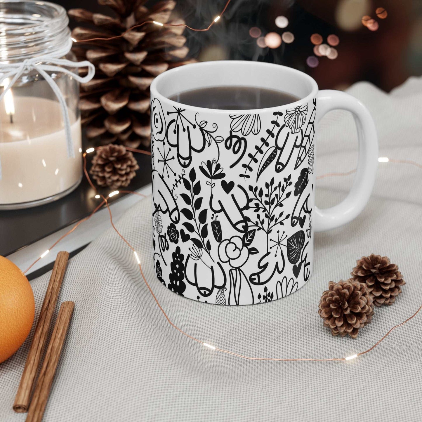 Cheeky Flower Willy Mug with black floral and playful willy illustrations on white ceramic coffee cup