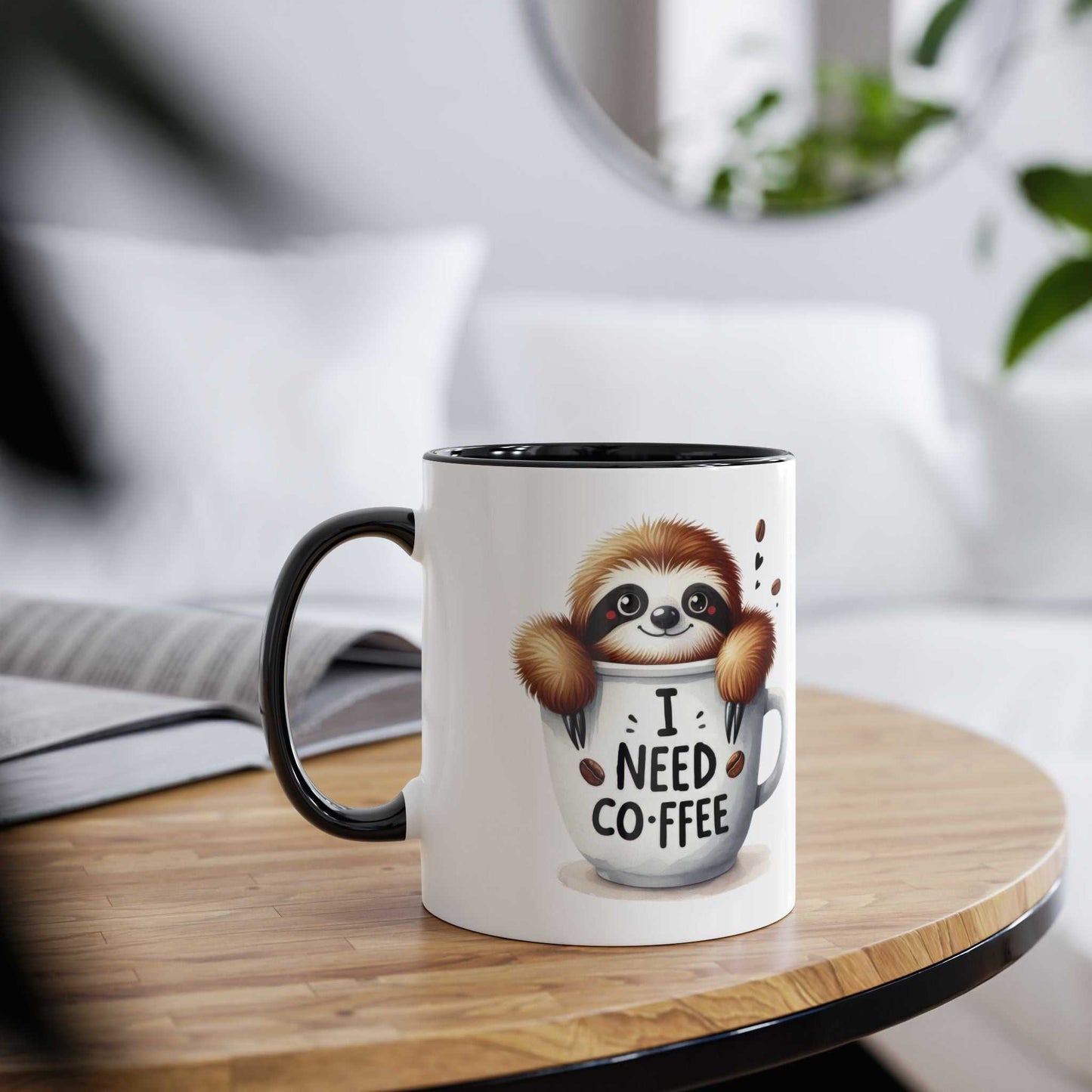 Cute sloth coffee mug with "I Need Coffee" design on wooden table.
