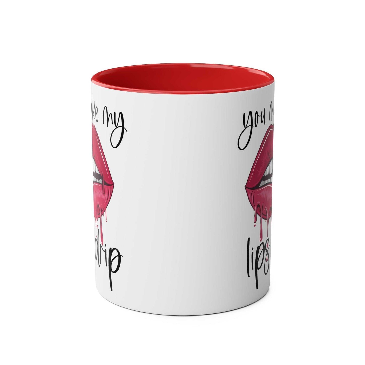 Ceramic mug with "You Make My Lips Drip" design, glossy white with red rim and handle.