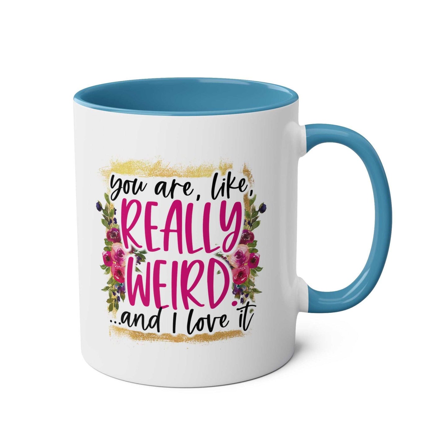 Really Weird Coffee Mug with humorous design, blue interior, and flower accents.