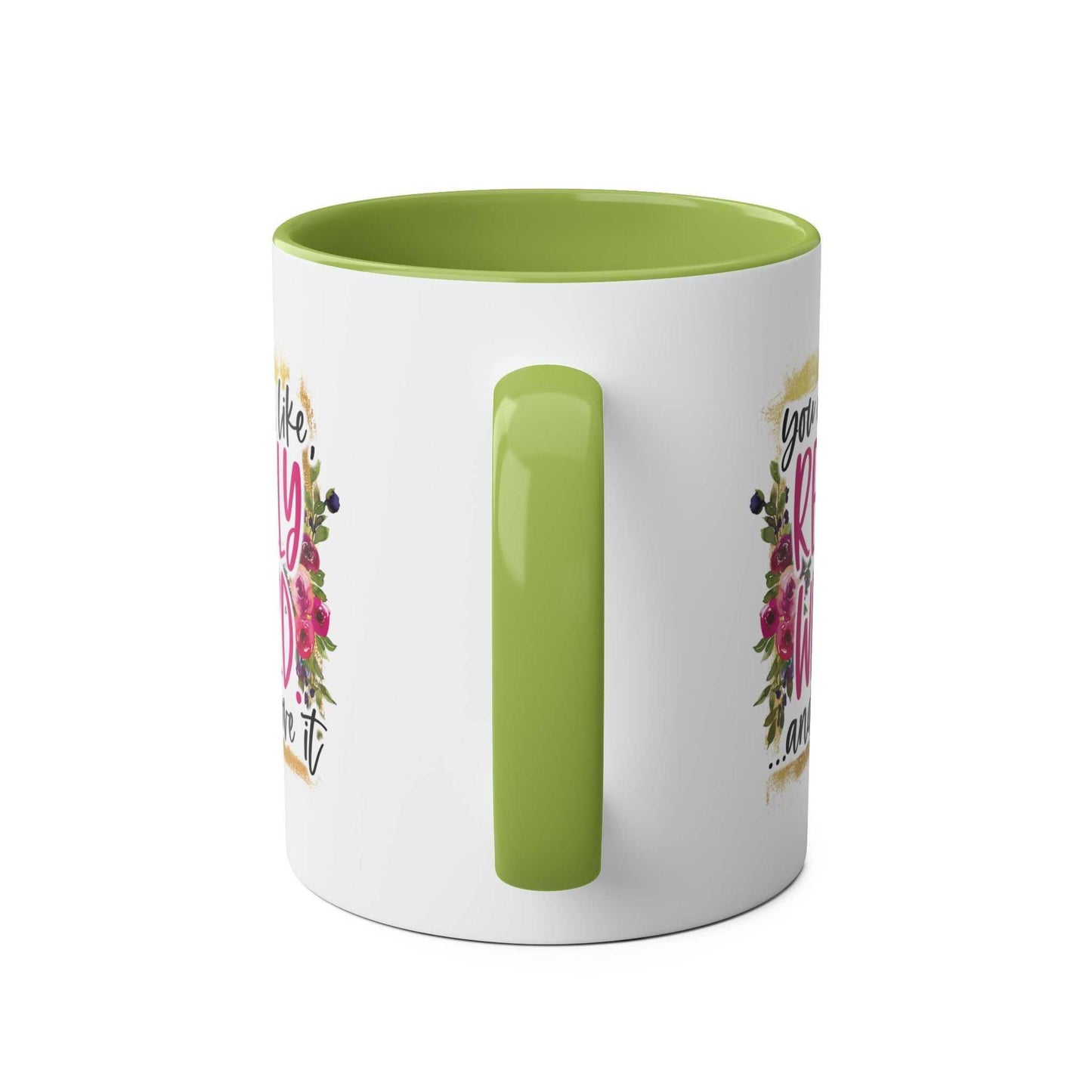 Green handle ceramic coffee mug with floral design, Really Weird Coffee Mug.
