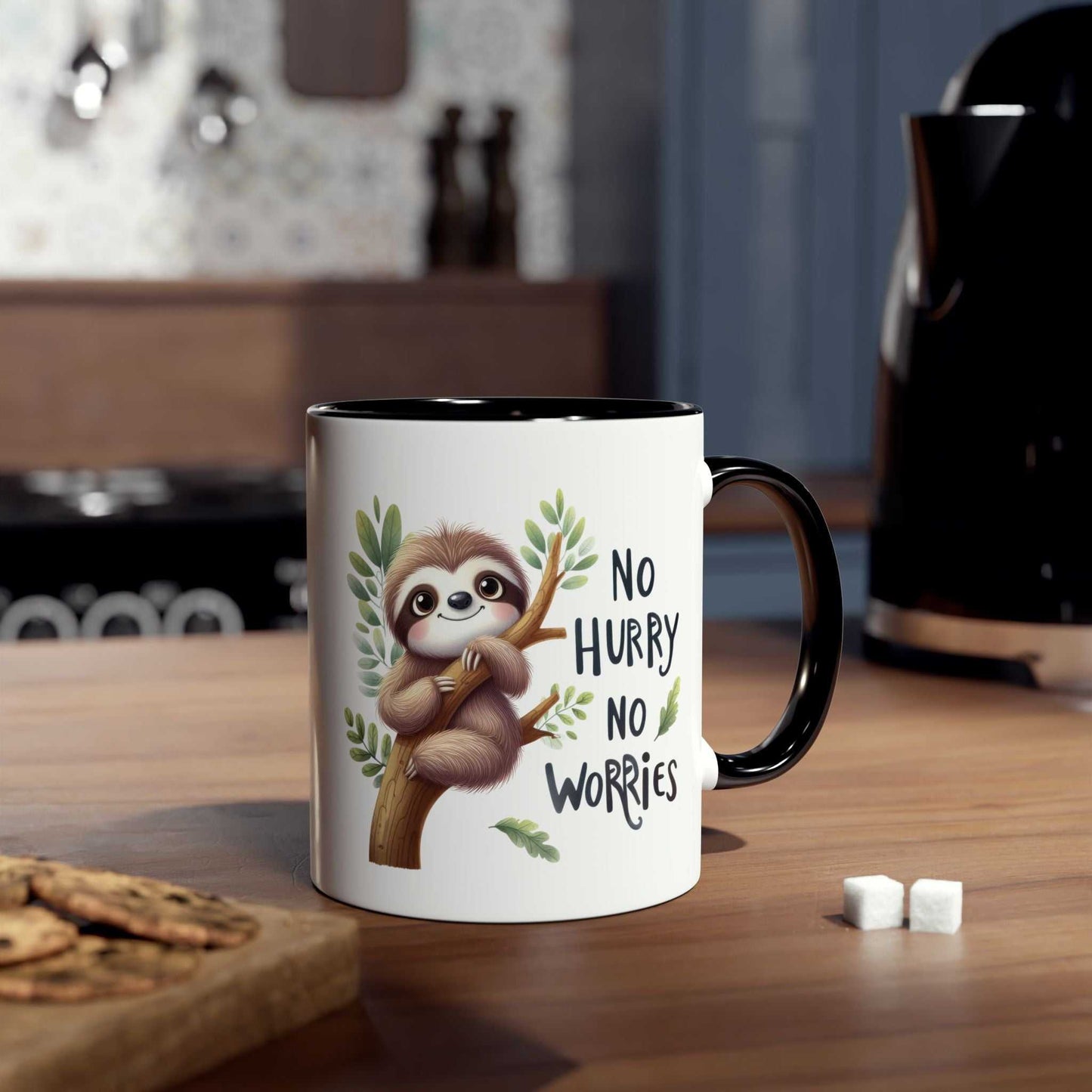 Cute sloth coffee mug with "No Hurry No Worries" design on kitchen counter.