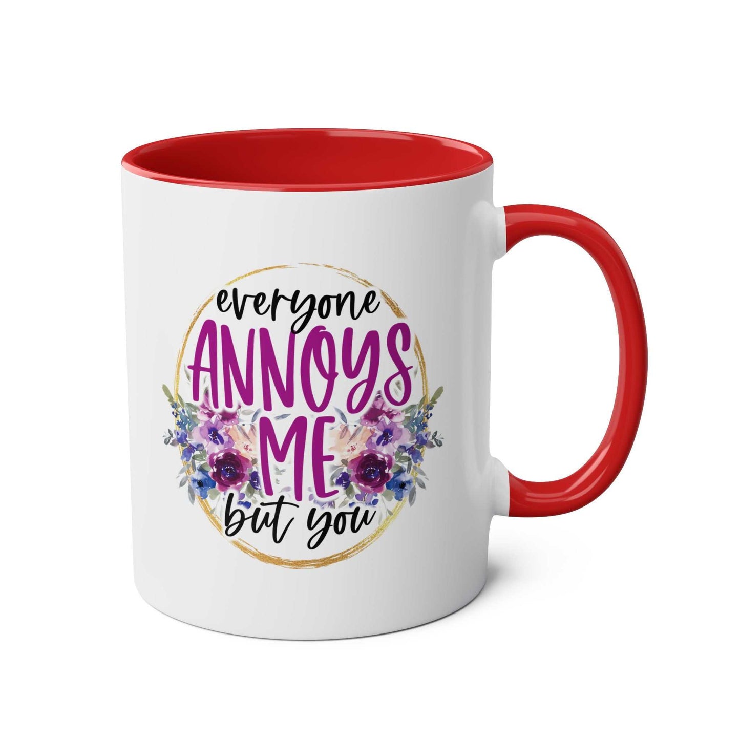Everyone Annoys Me But You coffee mug with floral design and red interior.