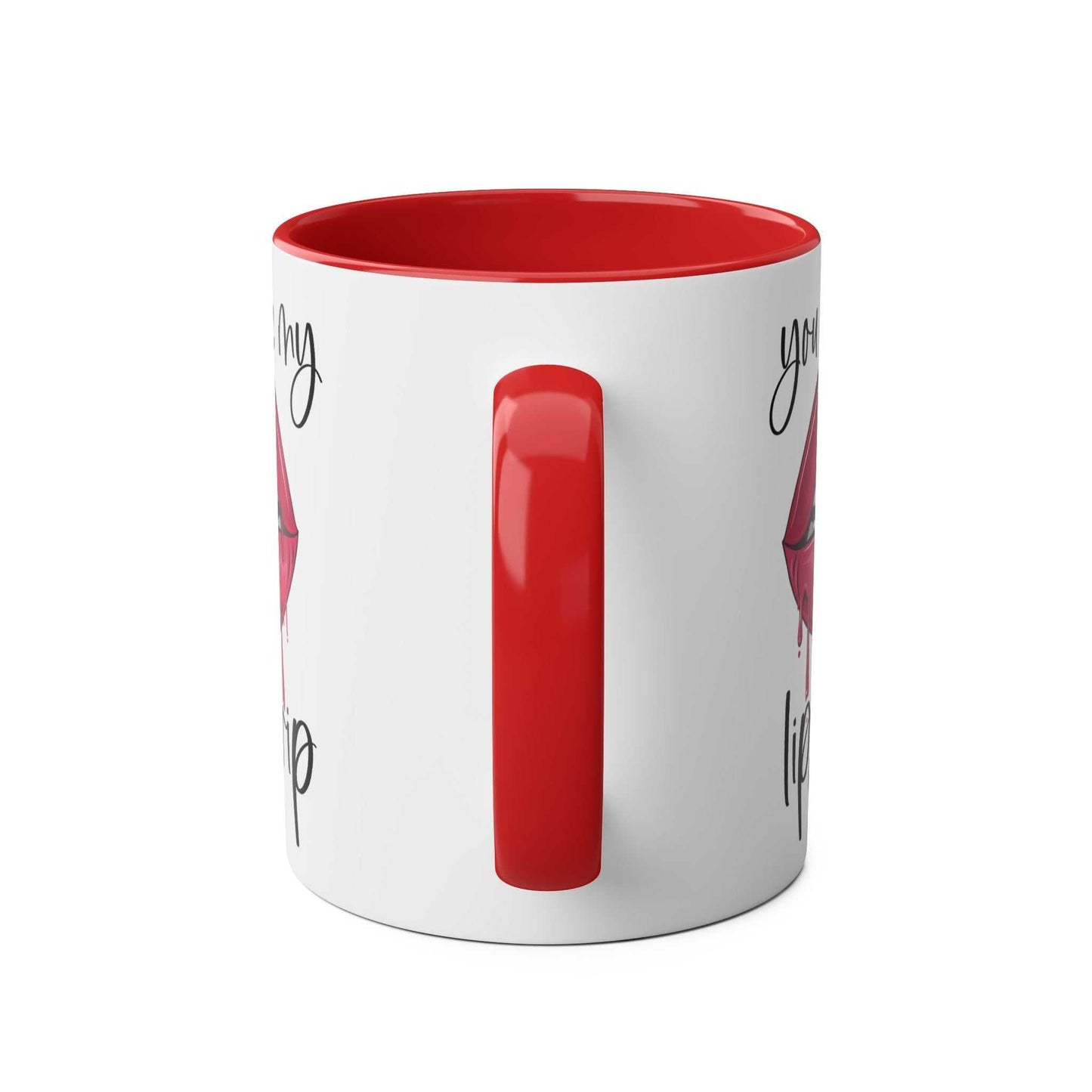 Ceramic mug with "You Make My Lips Drip" print, featuring a red rim and handle.