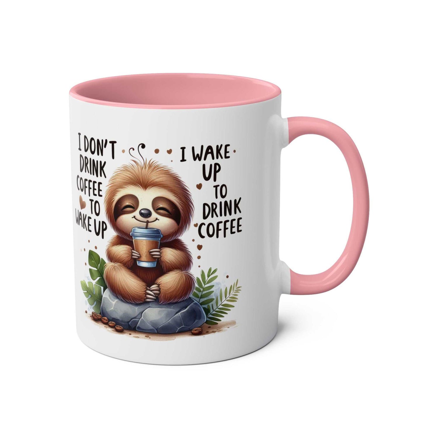 Cute sloth coffee mug with pink handle and whimsical design.