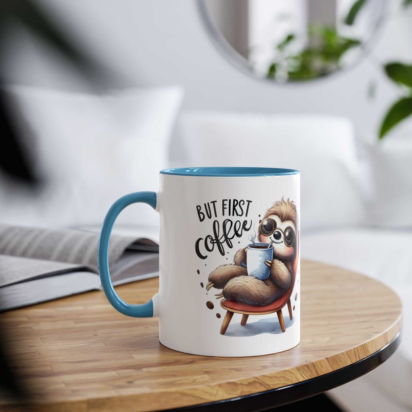 Cute sloth coffee mug with blue handle on a wooden table, perfect for animal lovers.