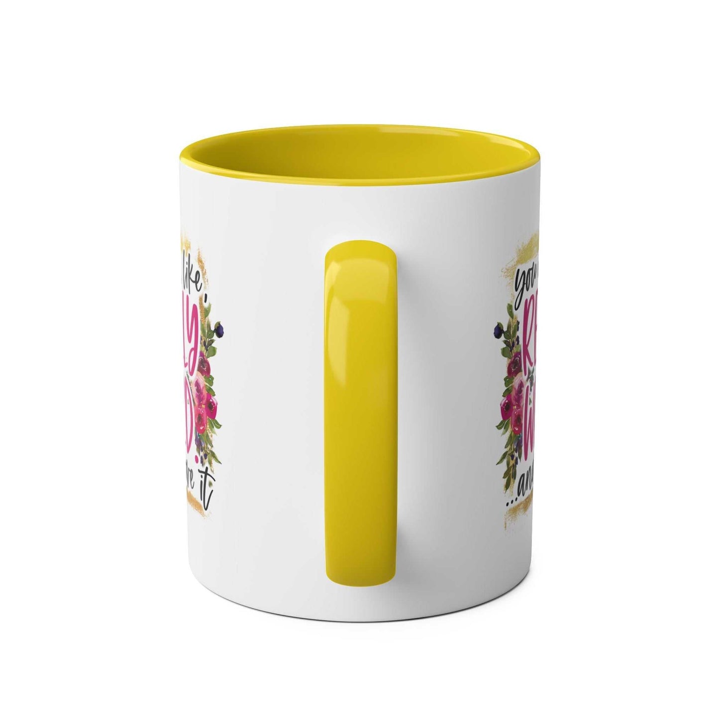 Yellow-handled Really Weird Coffee Mug with floral print and humorous text.