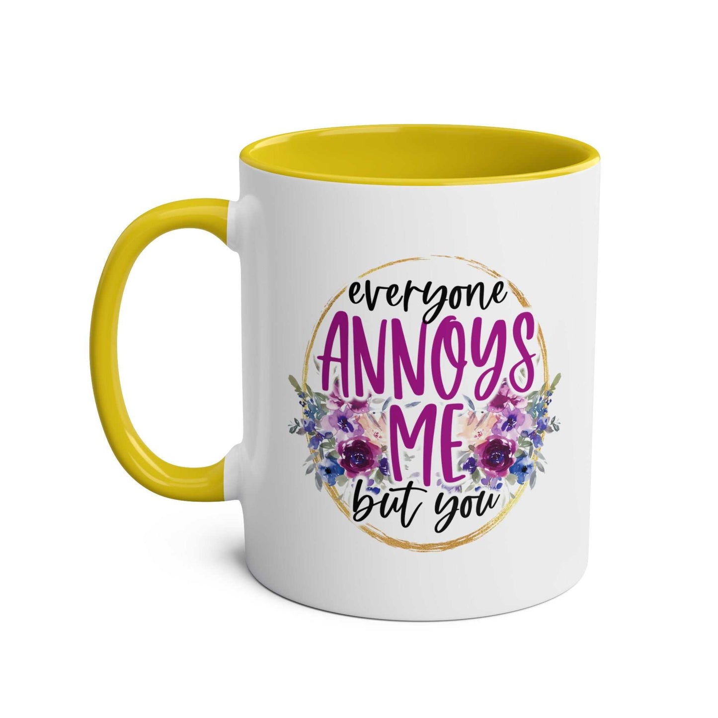 Everyone Annoys Me But You coffee mug with yellow handle and floral design.