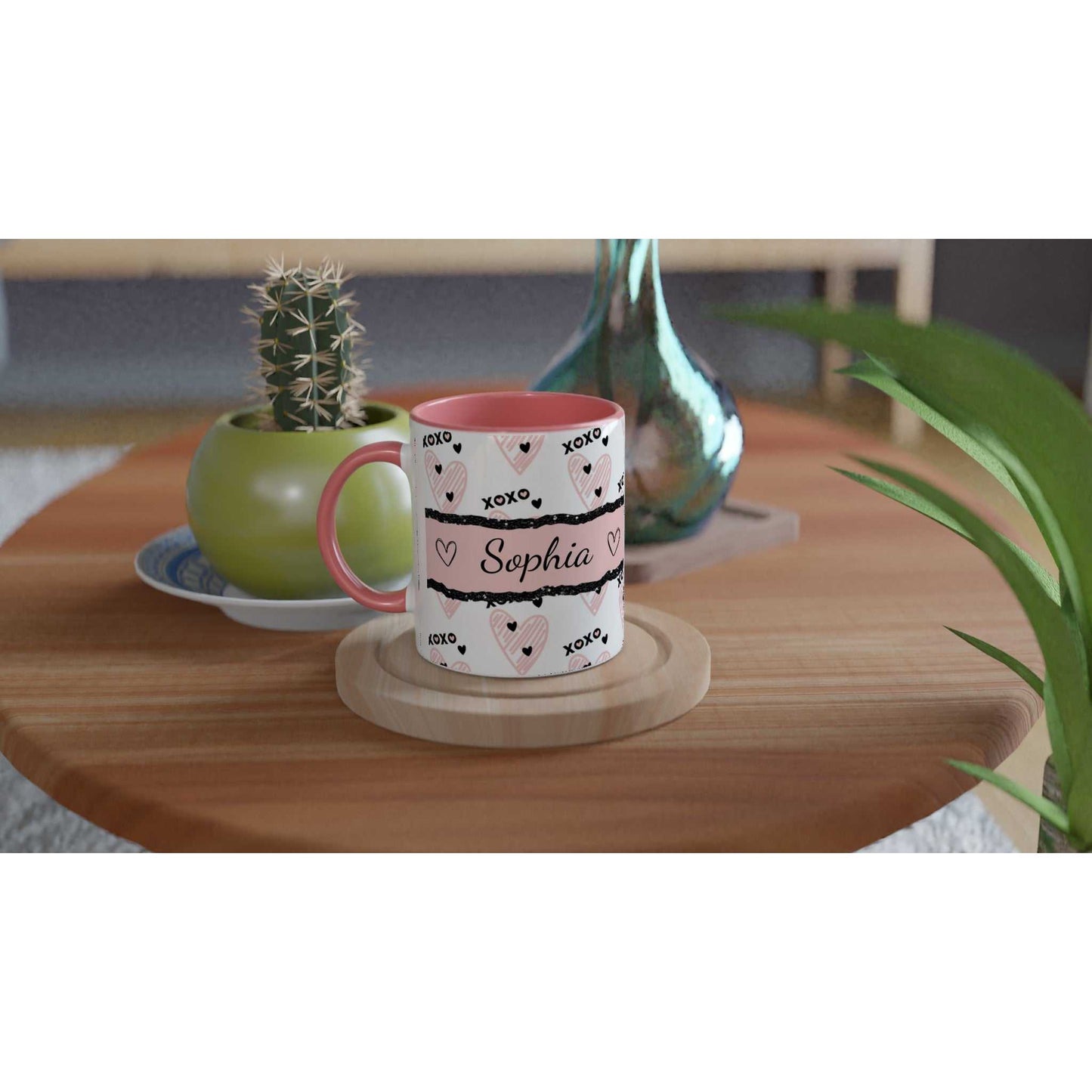 Personalised cute Valentines Day mug with heartwarming design and colored handle on a wooden table.