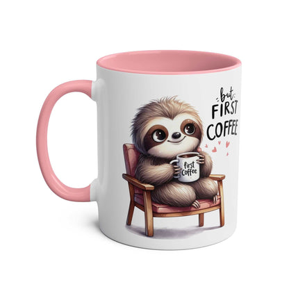 Cute sloth coffee mug with pink handle and inner, featuring a sloth holding a coffee cup in a chair with "But First Coffee" text.