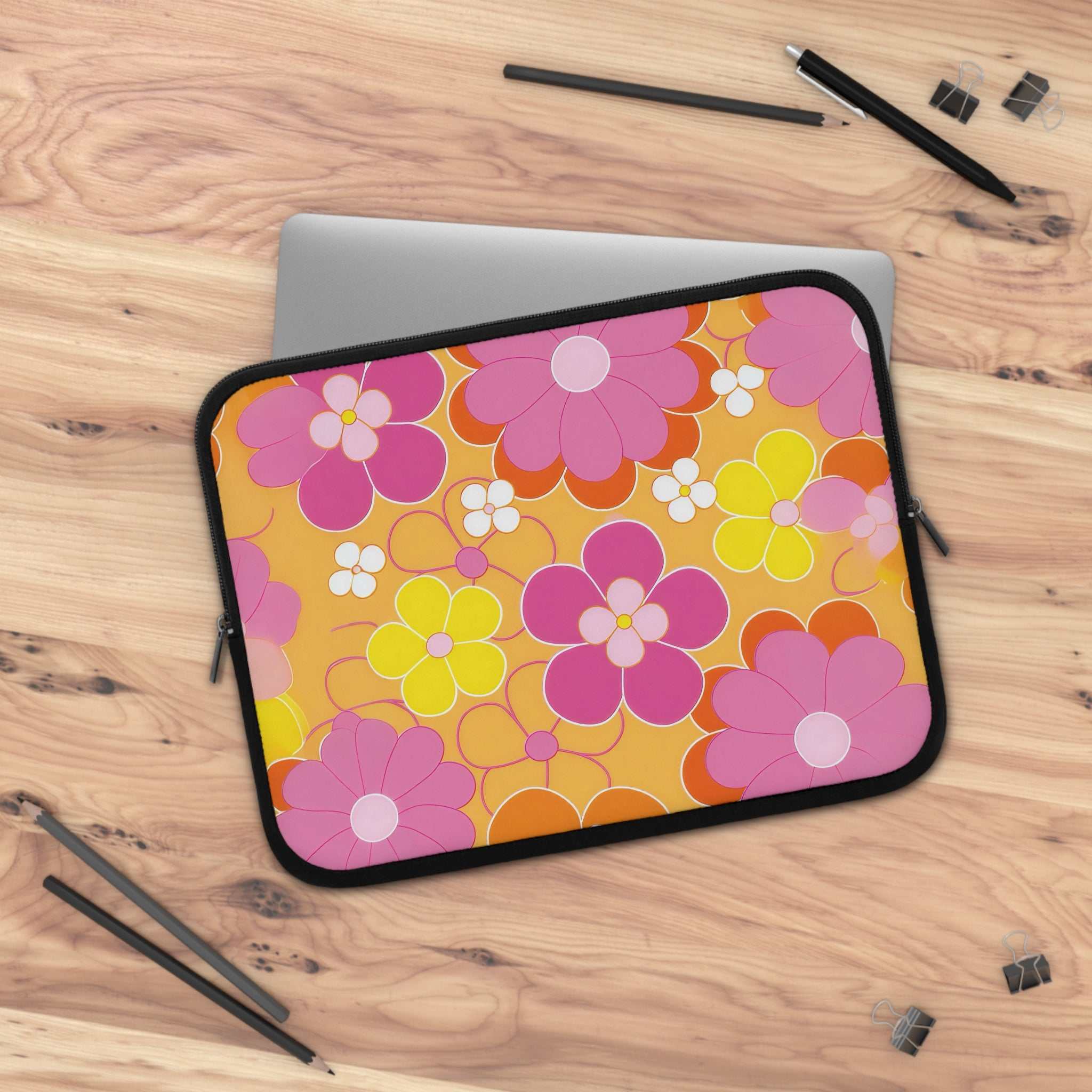 Retro floral laptop sleeve with vibrant pink, yellow, and orange flowers on a yellow background, neoprene material with dual zipper protection.