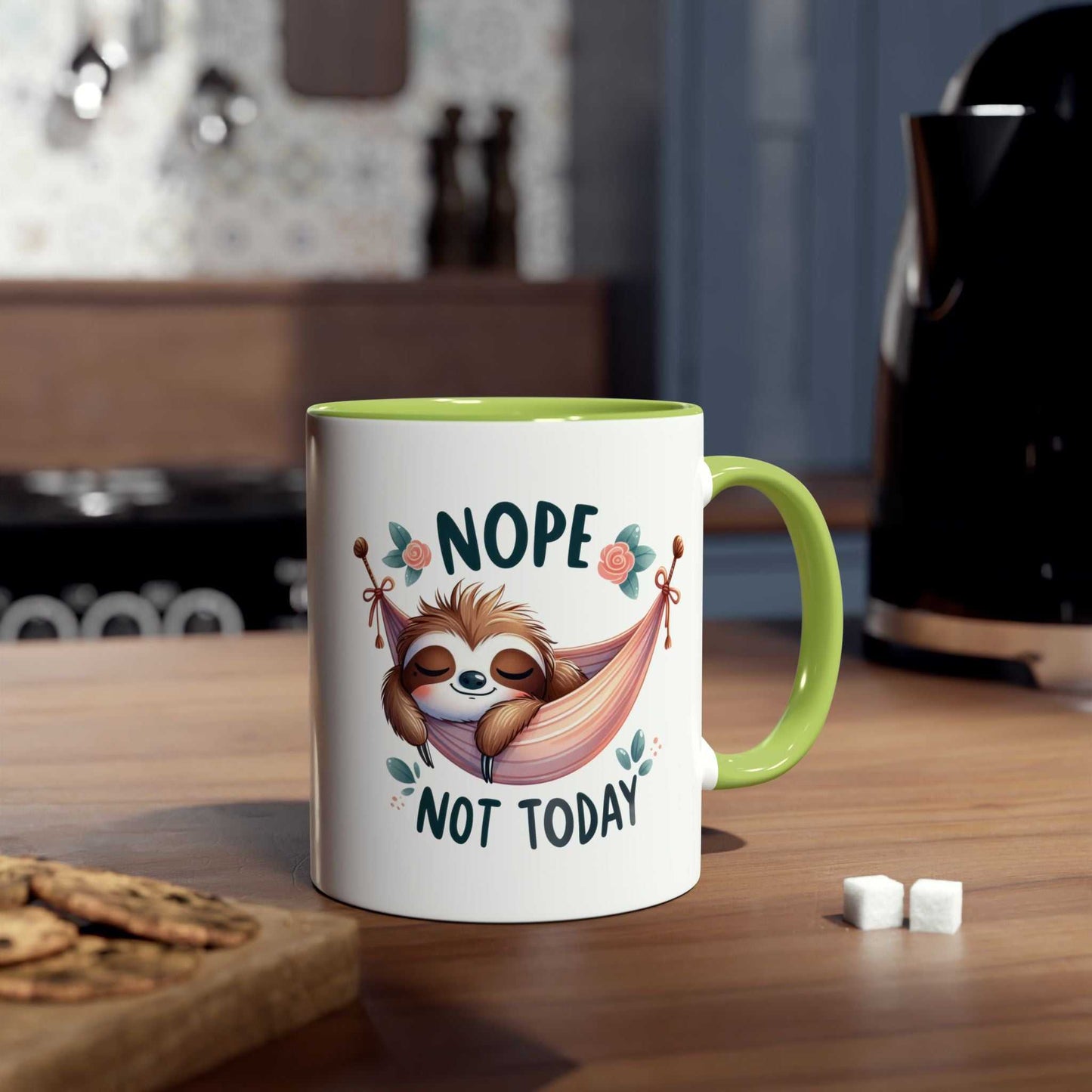 Cute sloth coffee mug with "Nope Not Today" design, glossy finish, 11oz ceramic, green handle, in cozy kitchen setting.