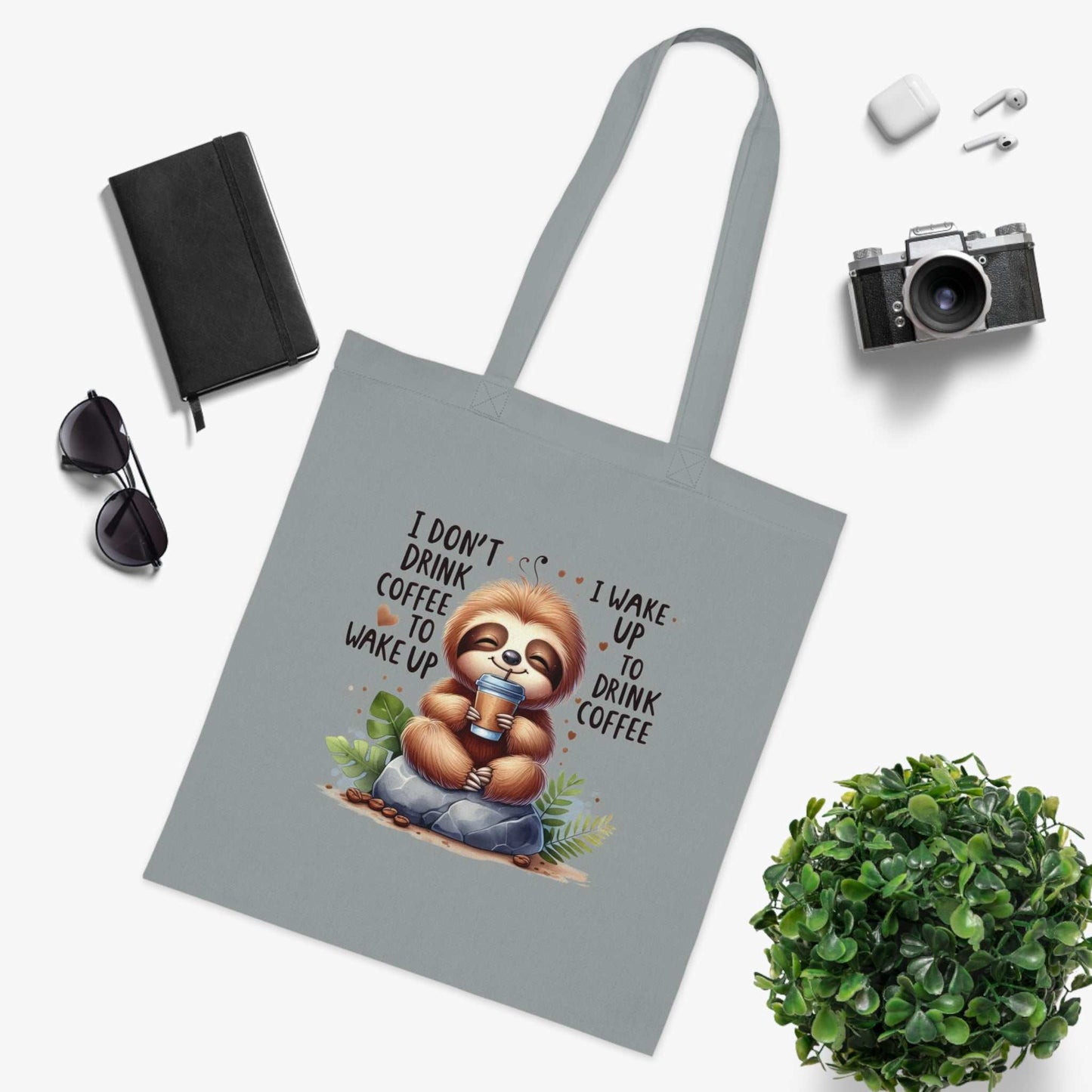 Cotton tote bag with cute sloth design, perfect for essentials, 100% cotton, vibrant colors.