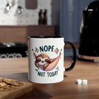 Cute sloth coffee mug with "Nope Not Today" design on kitchen counter.