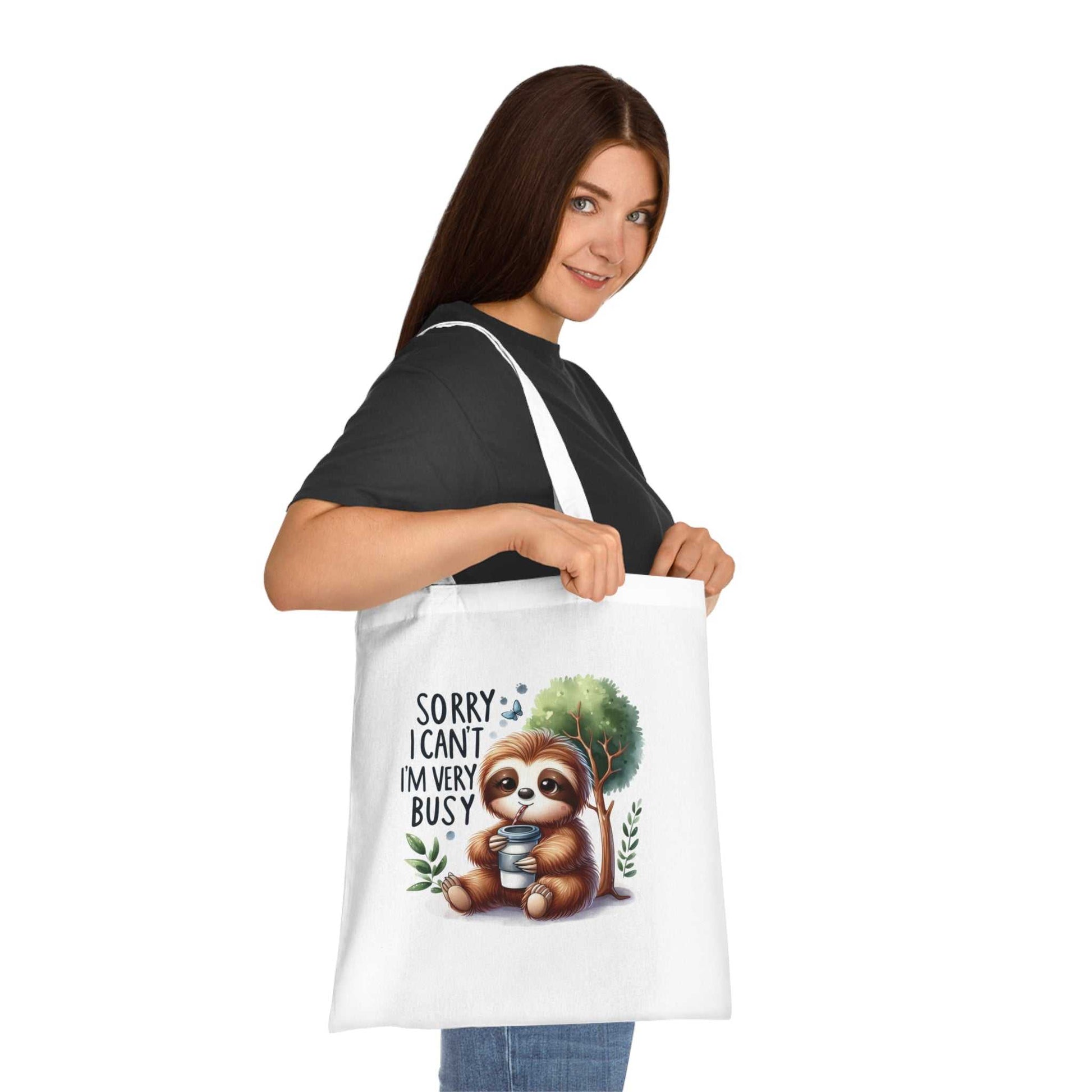 Cute sloth tote bag in cotton with vibrant design, ideal for sloth enthusiasts, featuring durable handles and a playful print.