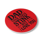 Dad Farts Stink ceramic coaster with bold black text on red background and cork backing for non-slip use