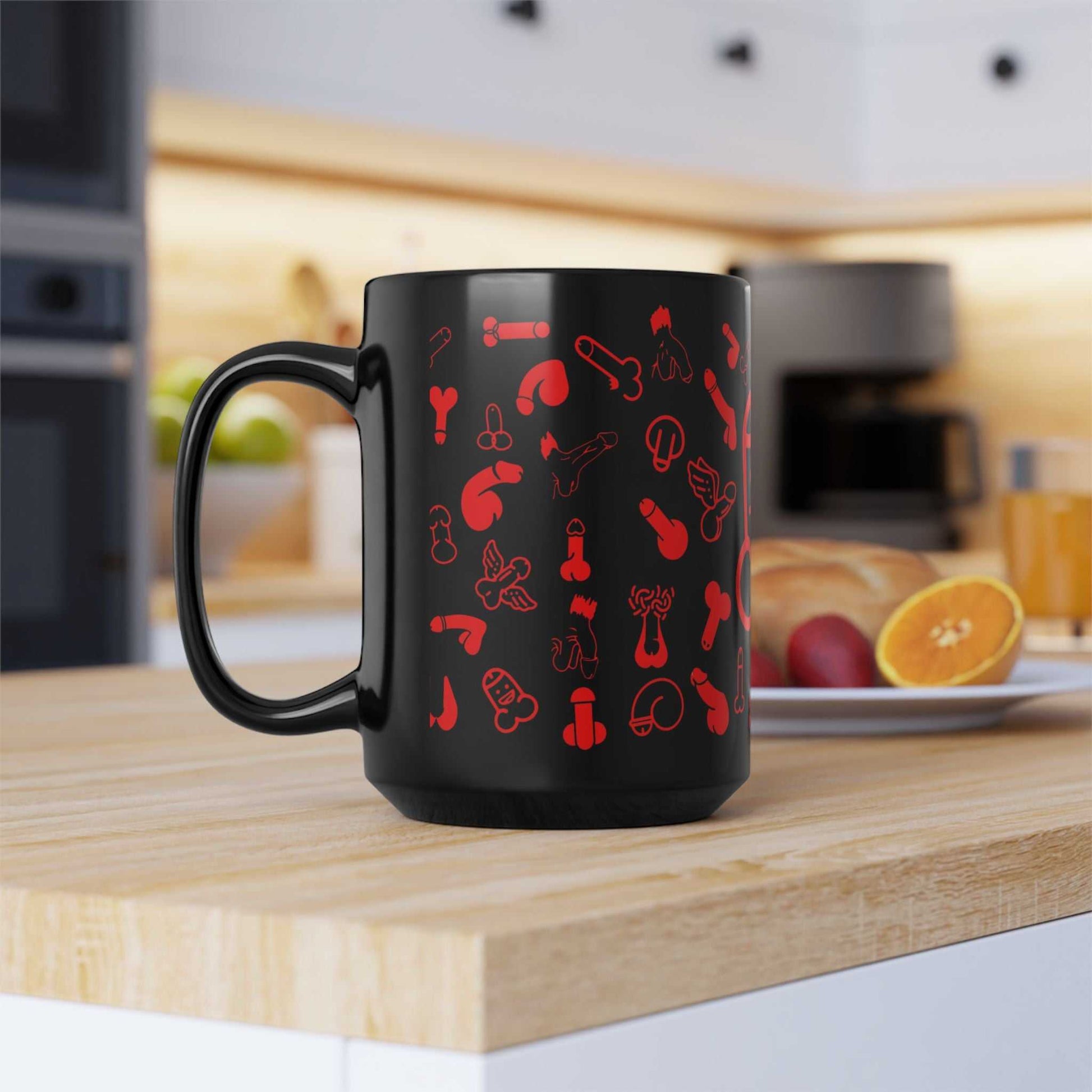 Cheeky Fun Red Willie Mug with playful red print on black ceramic, kitchen setting.