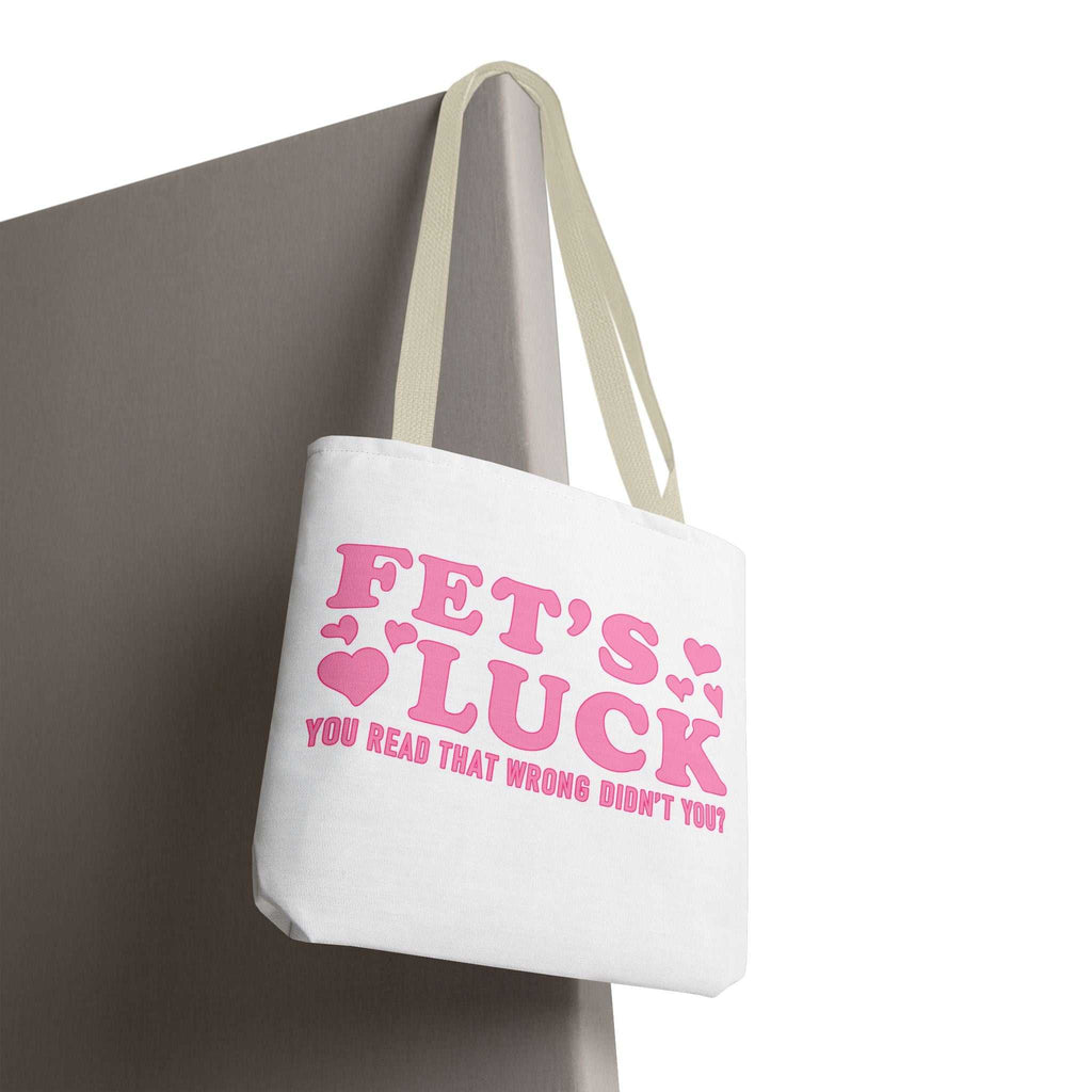 Pink heart tote bag with cheeky fun design and colorful handles for everyday use
