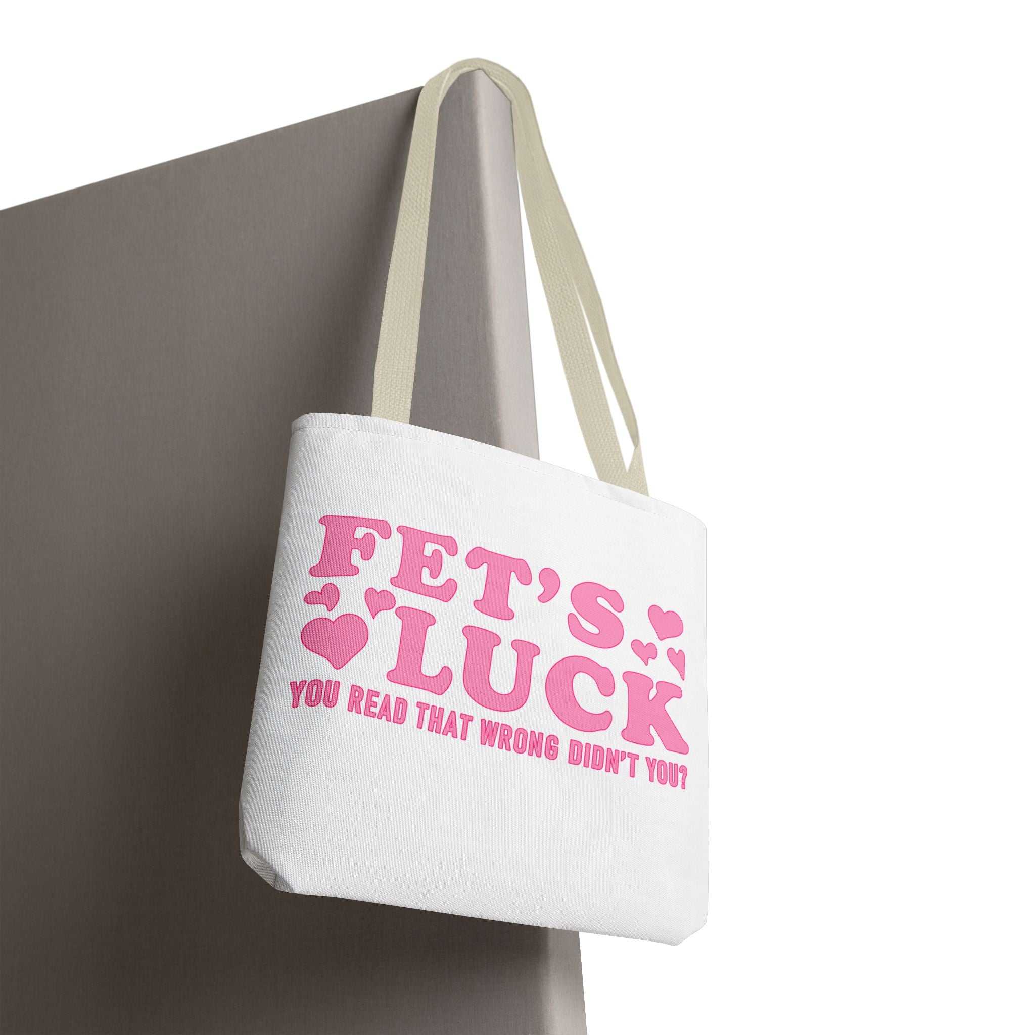 Pink heart tote bag with cheeky fun design and colorful handles for everyday use