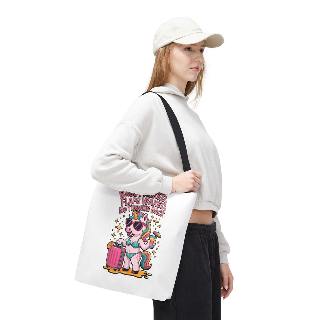 Fun unicorn travel tote bag with cheeky printed design and colorful handles, available in three sizes.