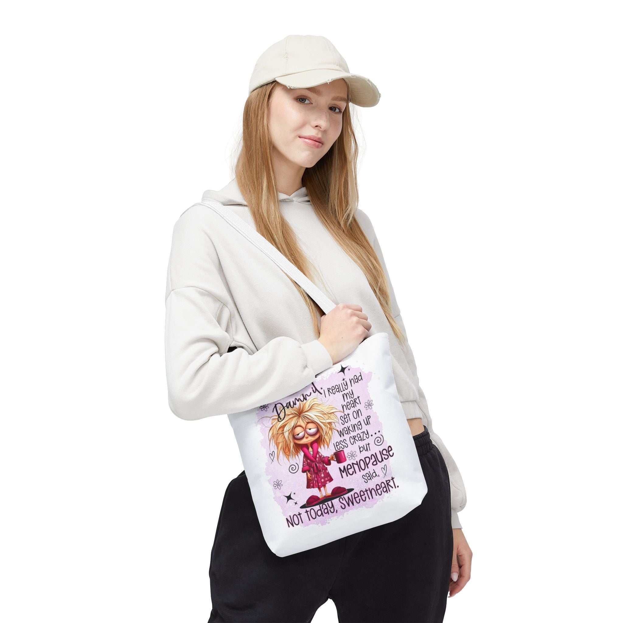 Cheeky menopause humour tote bag with fun design, durable spun polyester, multiple sizes and handle colors for everyday use