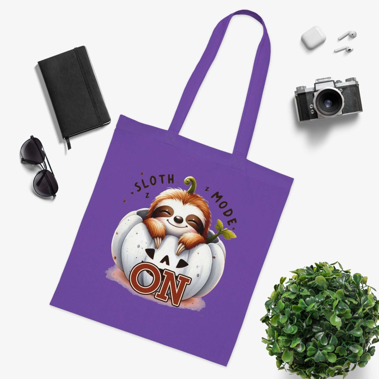 Cotton tote bag with cute sloth design, purple color, 100% cotton, perfect for carrying essentials.