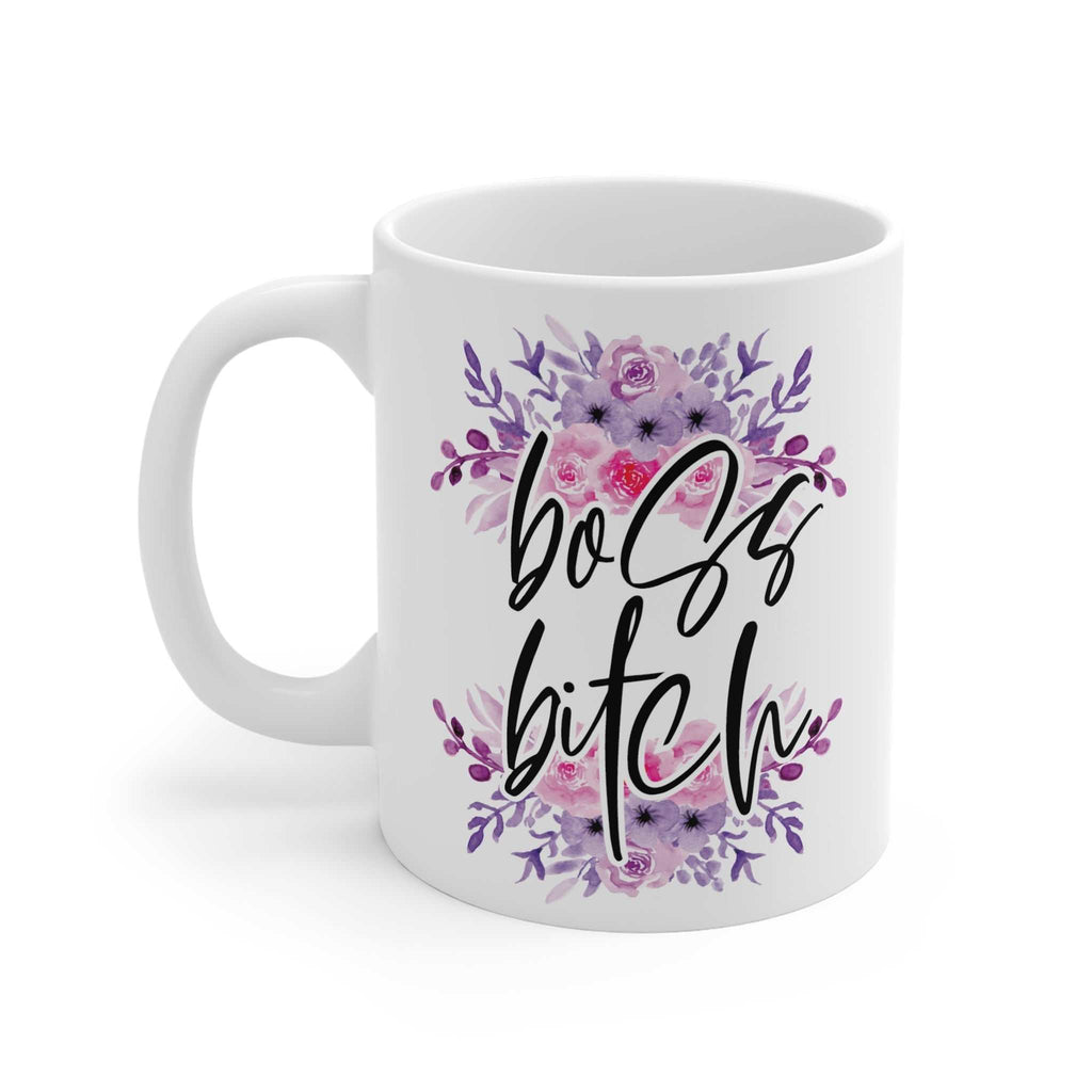 White ceramic coffee mug with "boss bitch" text and purple floral design, 11oz glossy finish, microwave and dishwasher safe.
