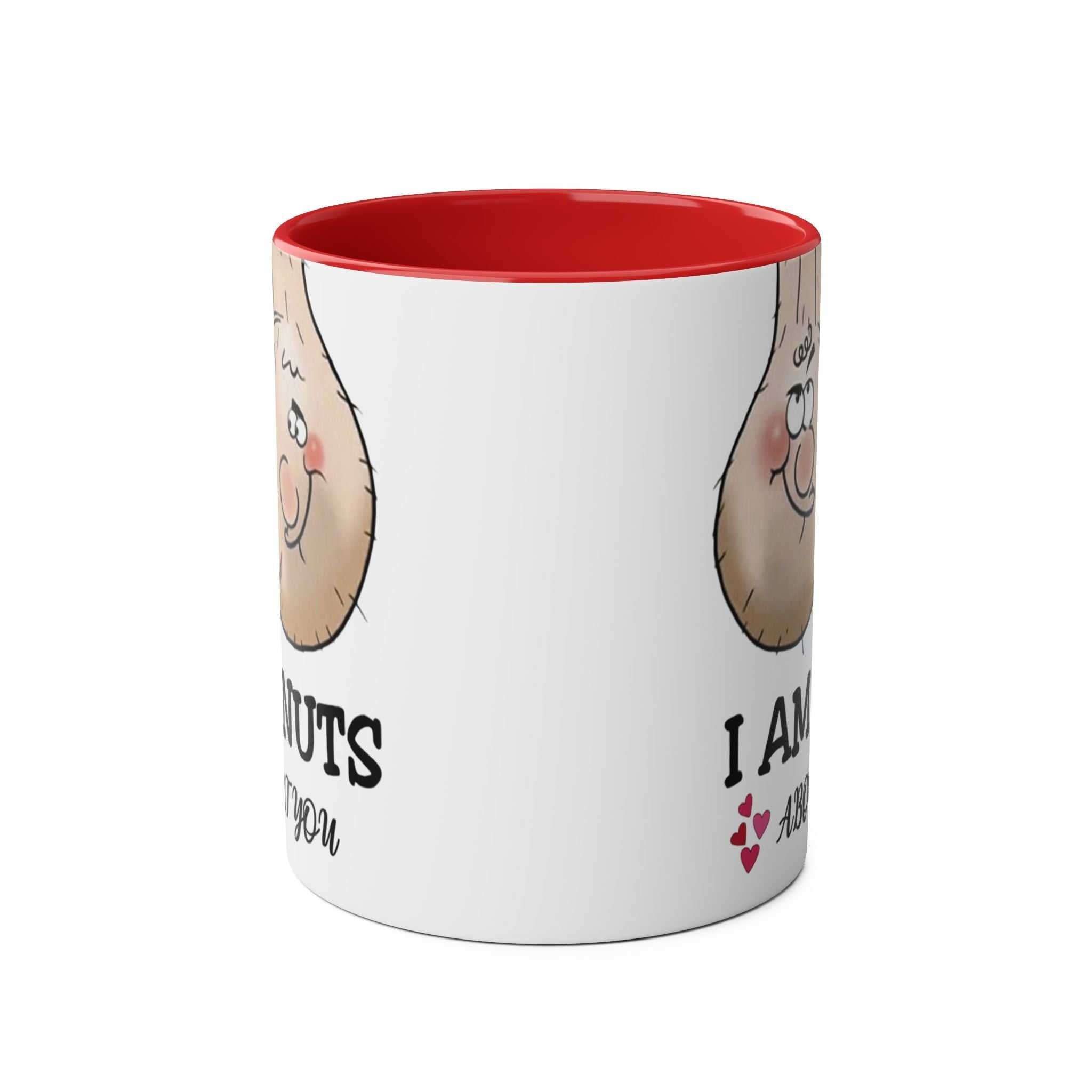 Ceramic mug with "I Am Nuts About You" print, red interior and handle, humorous gift.