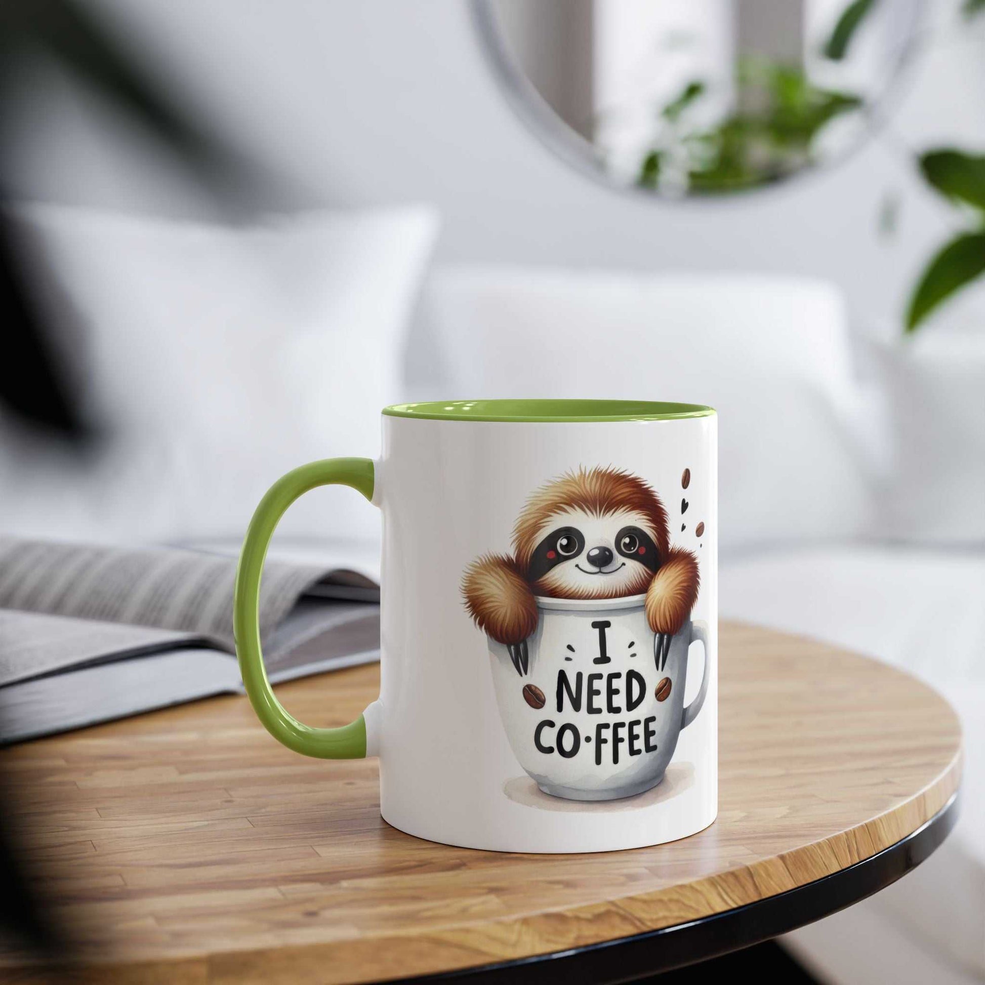 Cute sloth coffee mug with "I Need Coffee" print, green interior, and glossy finish on a wooden table.