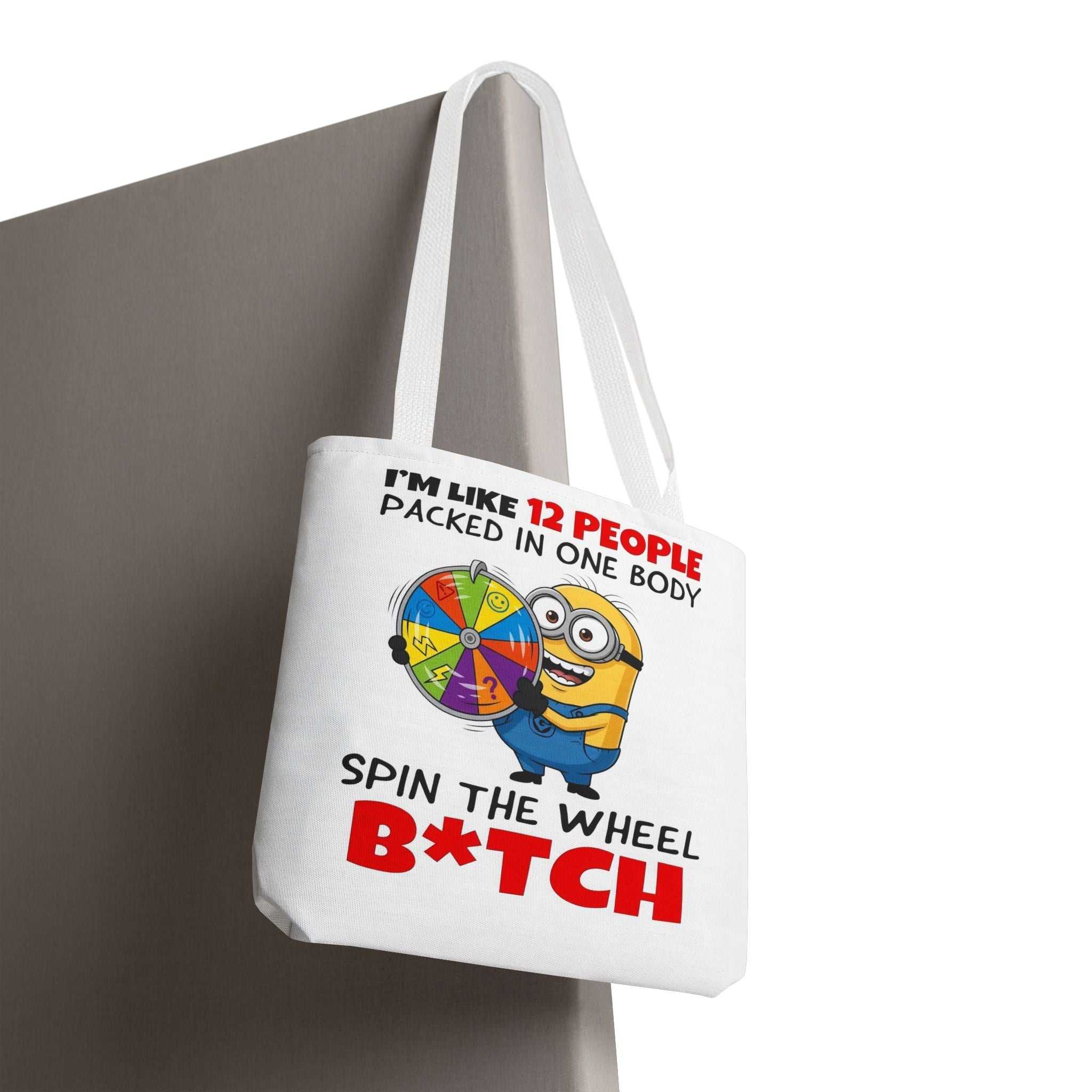 Funny Minion tote bag with cheeky design, durable polyester, and multiple handle color options.