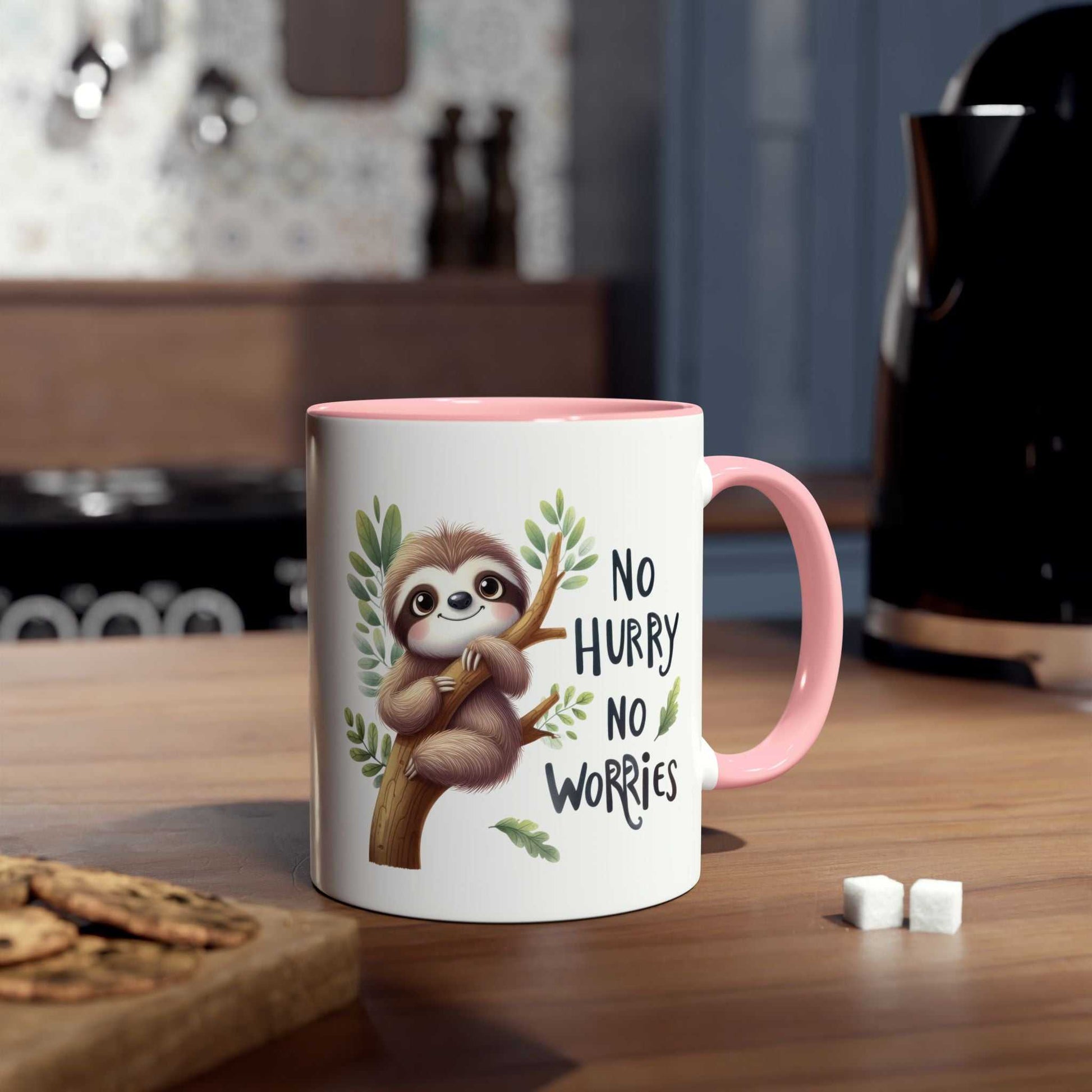 Cute sloth coffee mug with whimsical design and pink handle on a kitchen counter.