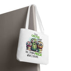 Fun cactus tote bag with cheeky printed design and colorful handles, made from durable spun polyester