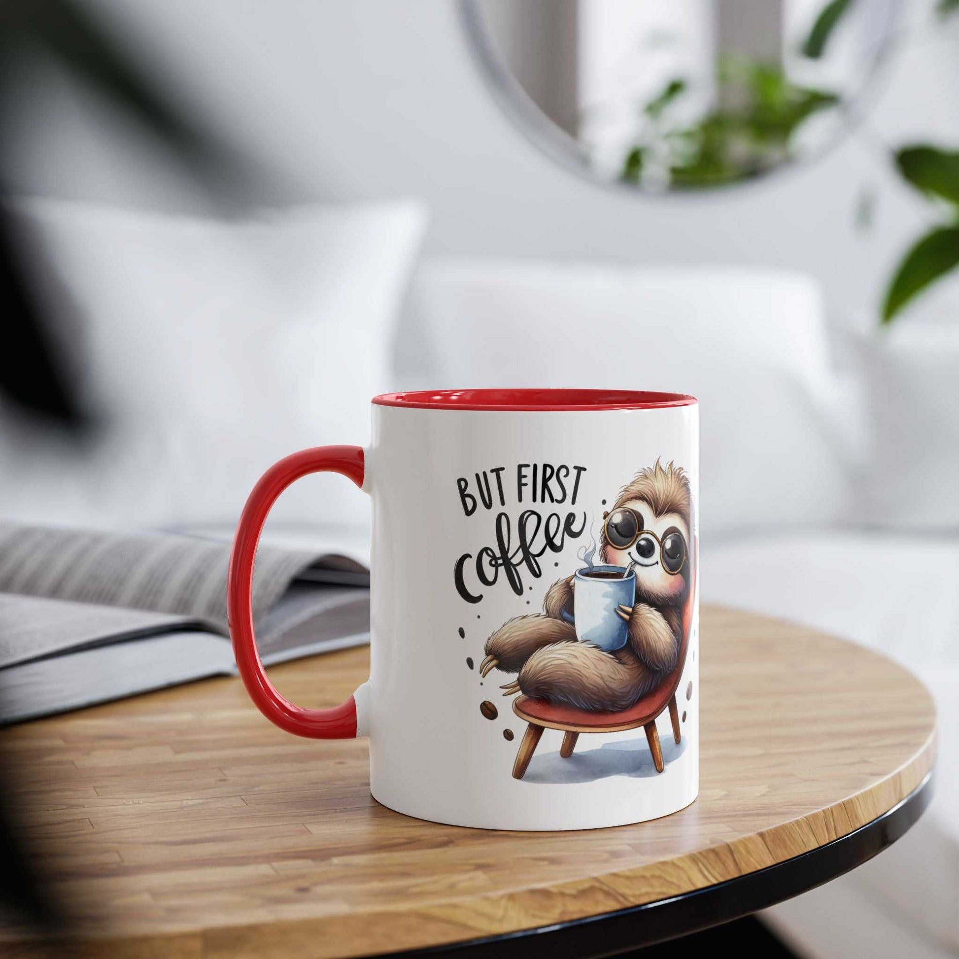 cute sloth coffee mug with red handle and "but first coffee" text on wooden table