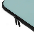 Teal green neoprene laptop sleeve with dual zipper and soft foam lining for protection
