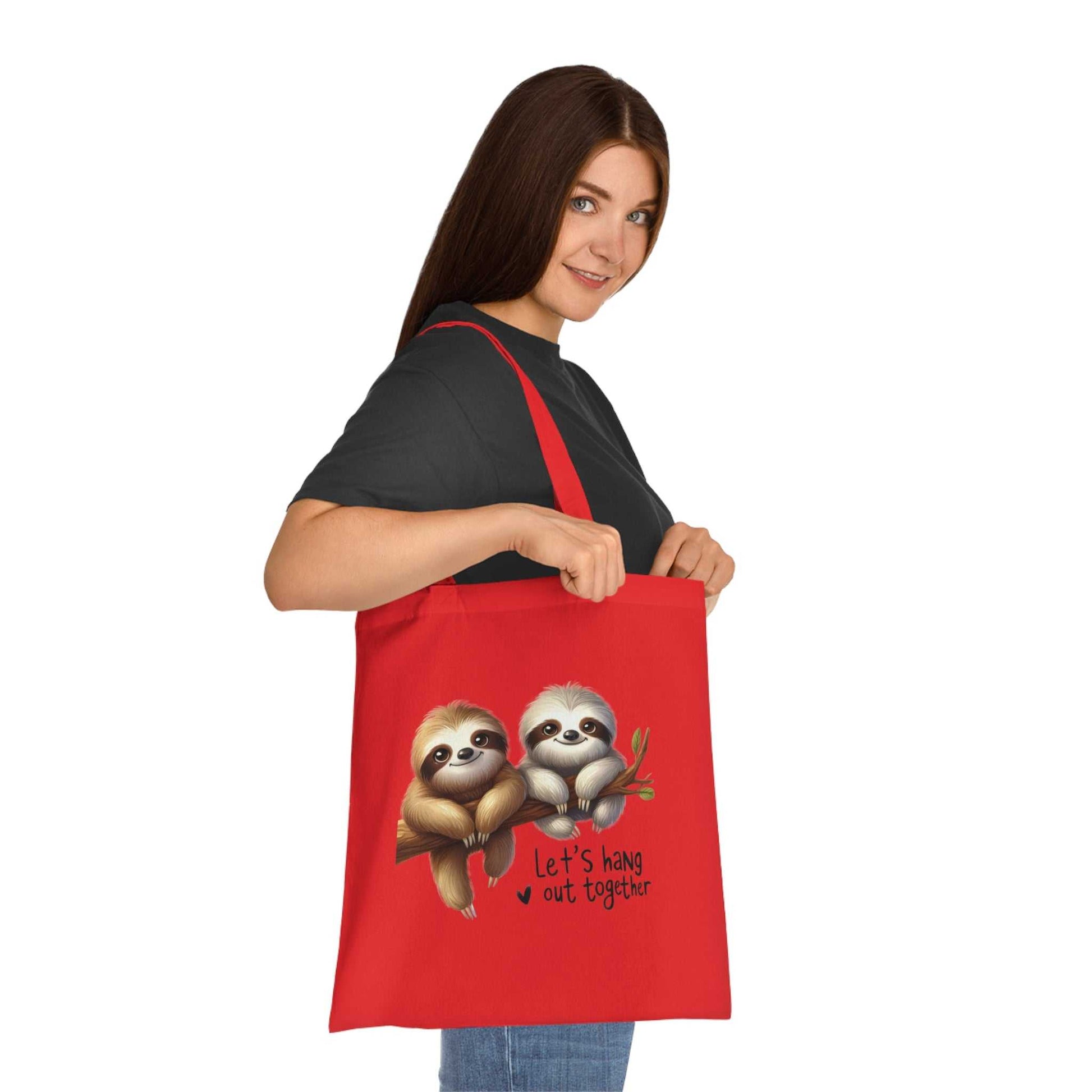 Cute sloth tote bag with vibrant design, 100% cotton, ideal for stylish everyday use.