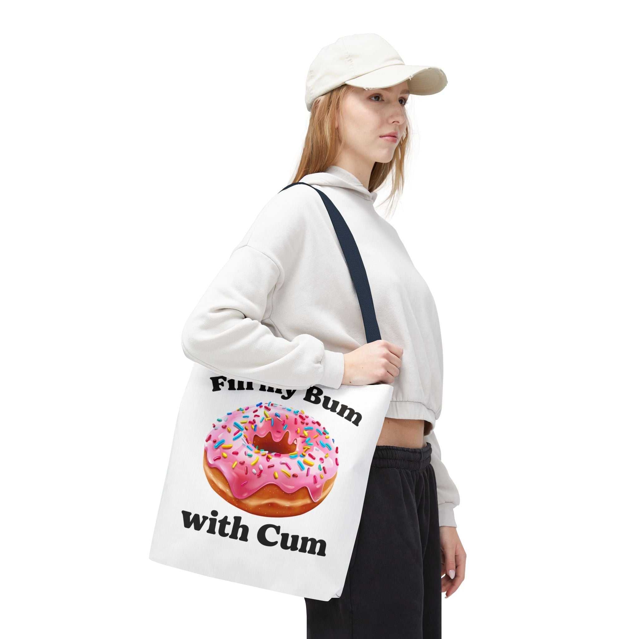 Provocative Donut Tote Bag with cheeky donut design, durable spun polyester, multiple sizes and handle color options, lightweight and reusable tote for errands and casual outings