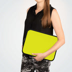 Woman holding bright yellow neoprene laptop sleeve with dual zipper and soft foam lining for protection