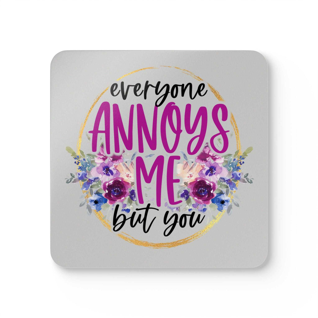 Everyone Annoys Me But You coaster set with playful design and floral accents.