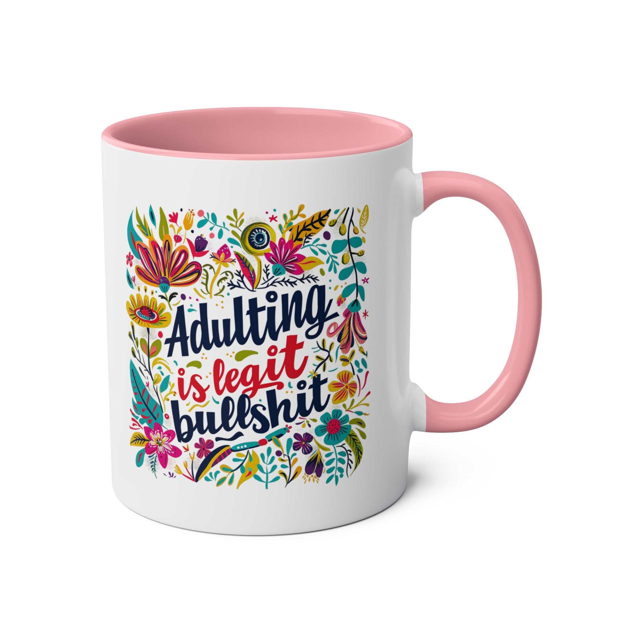 Colorful "Adulting Is Bullshit" coffee mug with floral design and pink handle.