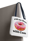 Provocative Donut Tote Bag with cheeky design, durable spun polyester, multiple sizes and handle colors, perfect for daily use