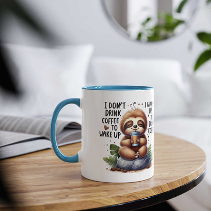 Cute sloth coffee mug with whimsical design, 11oz ceramic, glossy finish, and blue handle.