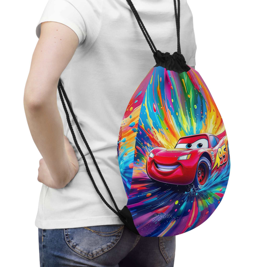 Child wearing colorful Cars-themed drawstring bag featuring red race car design and black cord straps