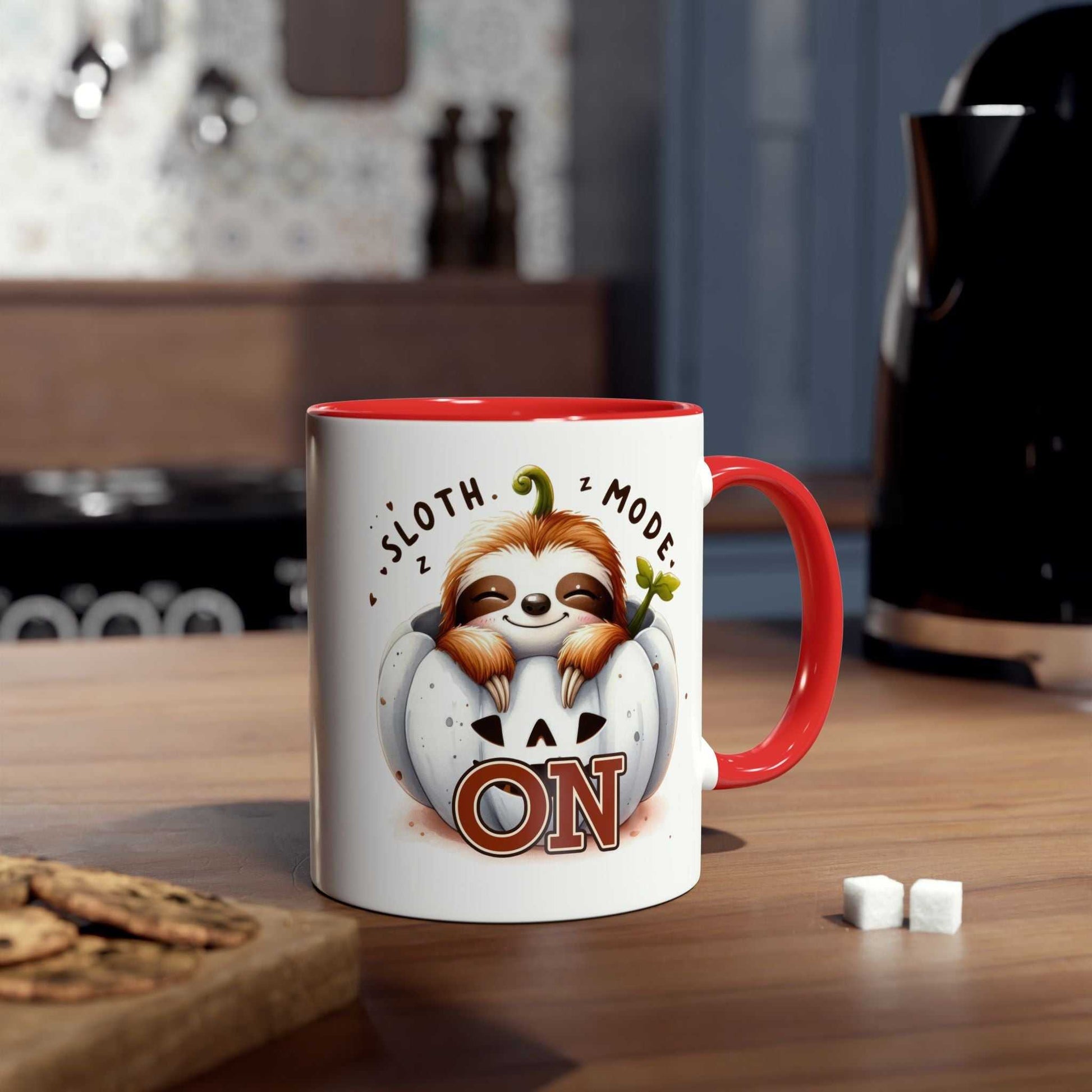 Cute sloth coffee mug with illustration, red interior, and handle on kitchen countertop. Ideal for animal lovers.