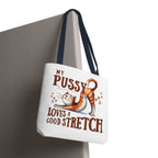Fun stretching cat tote bag with cheeky design and colorful handles for everyday use