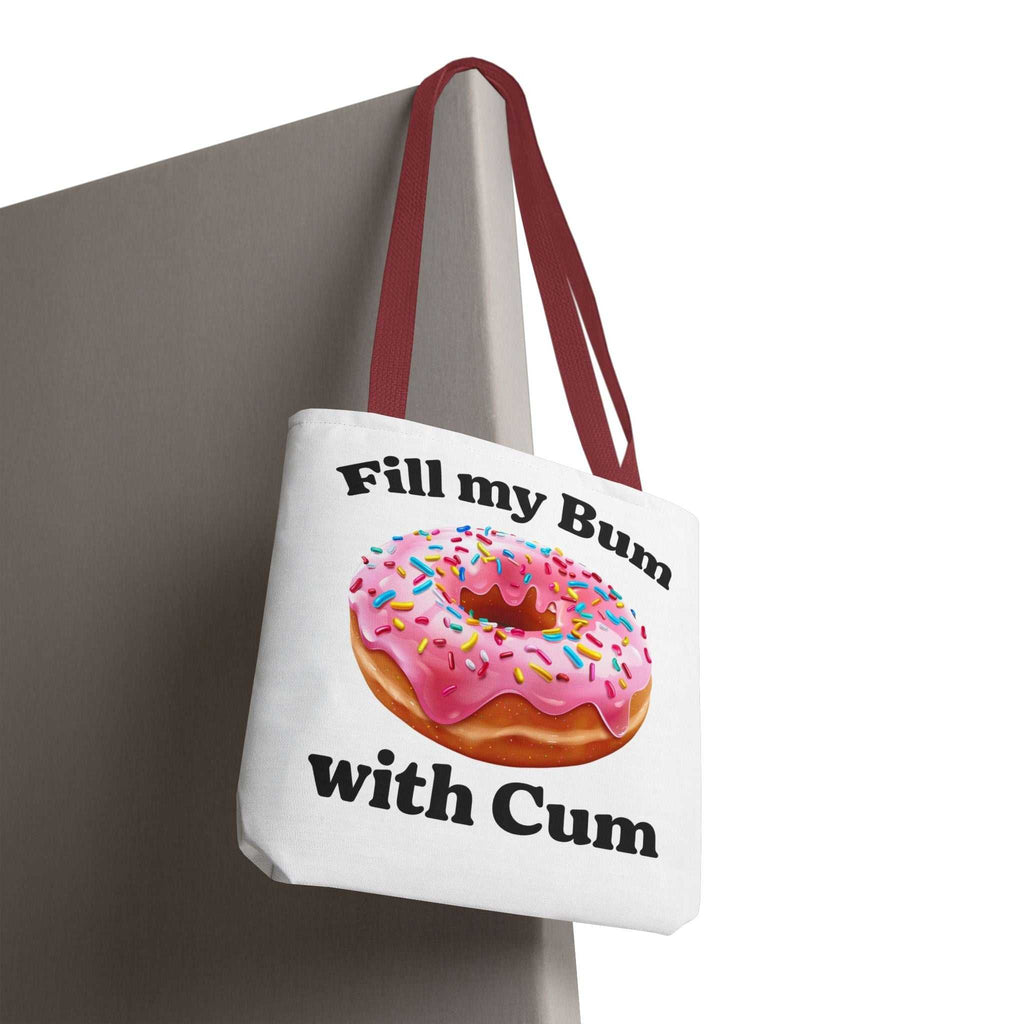 Provocative Donut Tote Bag with cheeky design, durable spun polyester, multiple sizes and handle colors, perfect for everyday use.